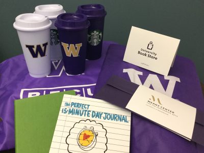 Coffee cups, UW bags and books.